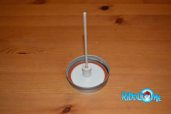 Hot glue the dowel into place